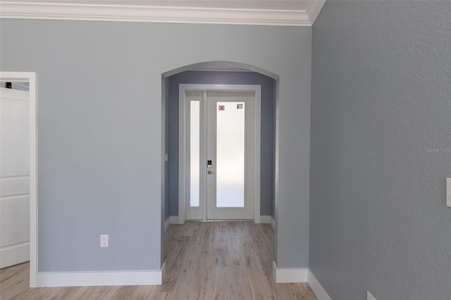 foyer featuring light hardwood / wood-style flooring and ornamental molding