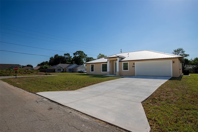 ranch-style house with a garage and a front yard