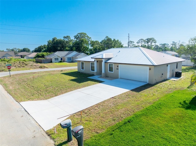 ranch-style house with central AC, a front yard, and a garage