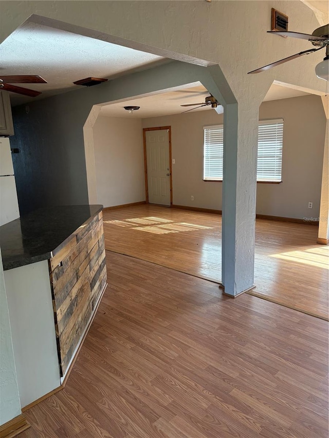 interior space with light hardwood / wood-style floors and a textured ceiling