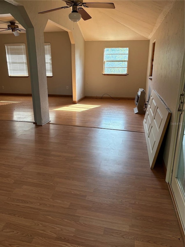 additional living space featuring ceiling fan, light hardwood / wood-style flooring, and vaulted ceiling