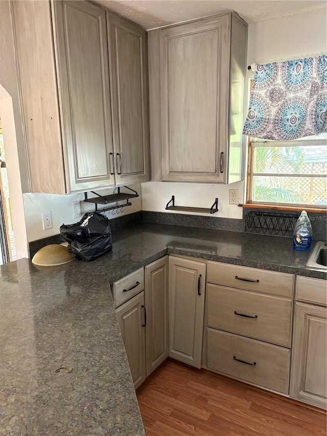 kitchen featuring light wood-type flooring and a textured ceiling