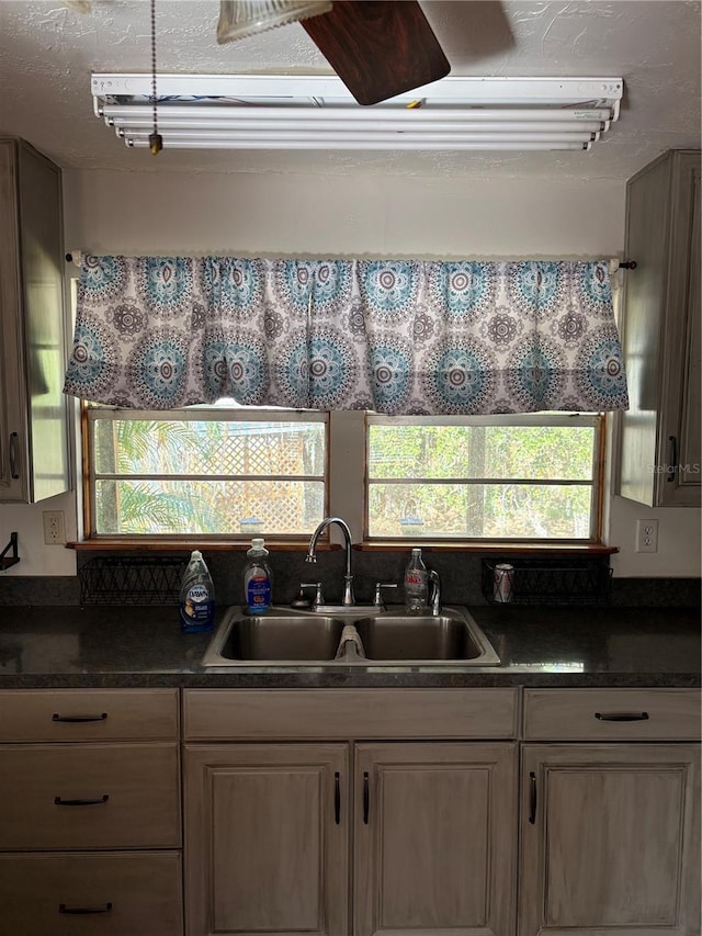 kitchen with sink and a textured ceiling