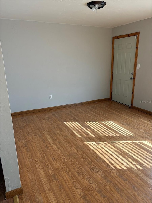 unfurnished room with light hardwood / wood-style floors