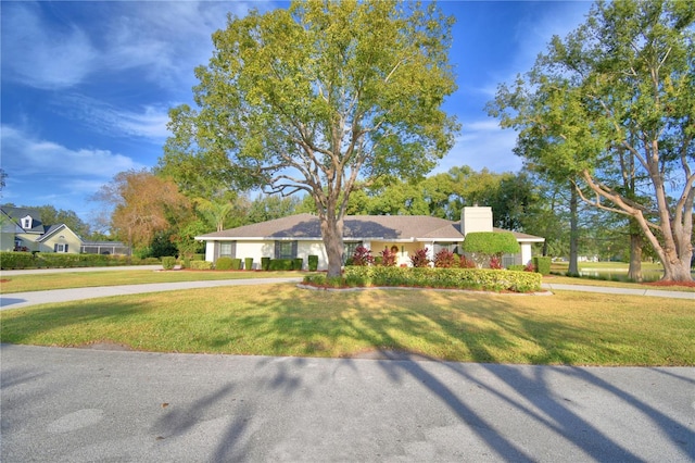 single story home with a front yard