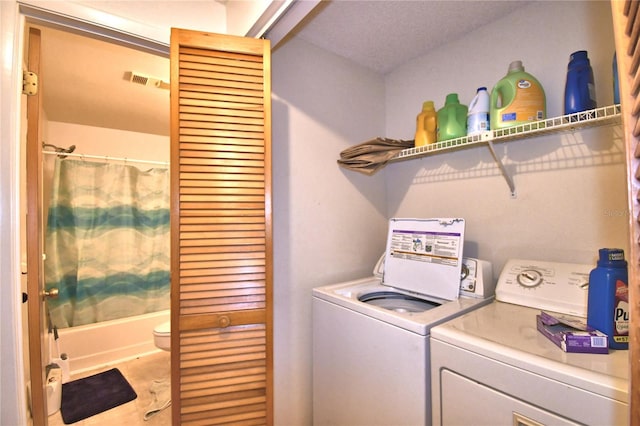 laundry room featuring washing machine and clothes dryer