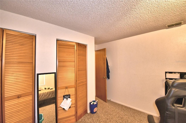 interior space with a closet and a textured ceiling