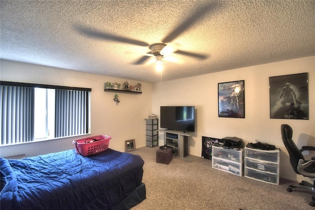 bedroom featuring carpet, a textured ceiling, and ceiling fan