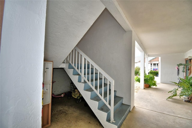 stairs with concrete floors