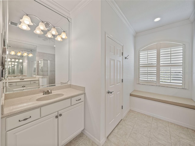 bathroom featuring vanity, tile patterned floors, a shower with door, and ornamental molding