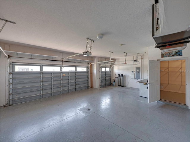 garage with electric panel and a garage door opener