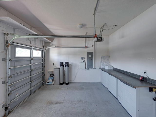 garage featuring electric panel and a garage door opener