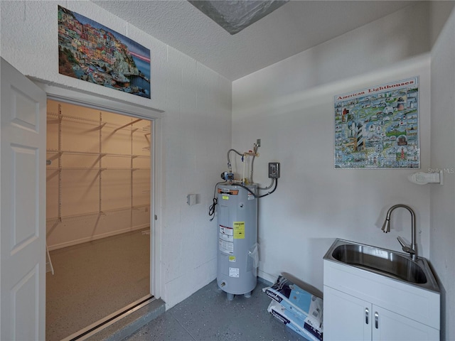 utility room featuring sink and water heater