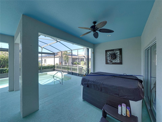 bedroom featuring a textured ceiling, carpet floors, and ceiling fan