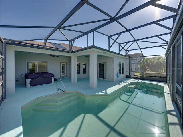 view of swimming pool with a lanai, a patio area, and ceiling fan