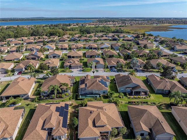 birds eye view of property with a water view