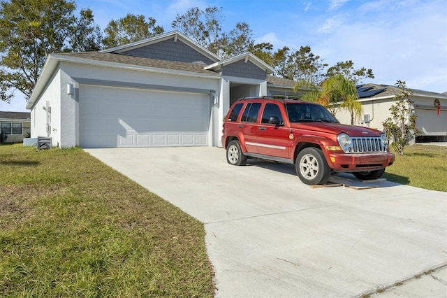 single story home with a front yard and a garage