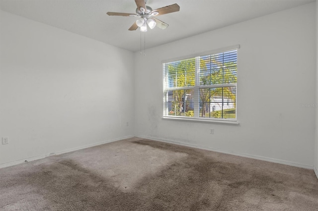 carpeted empty room with ceiling fan