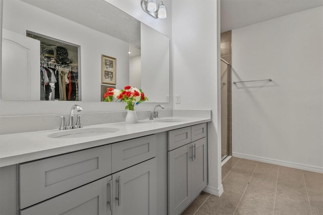 bathroom with vanity and an enclosed shower