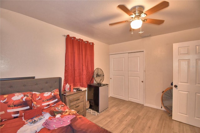 bedroom featuring ceiling fan and light hardwood / wood-style floors