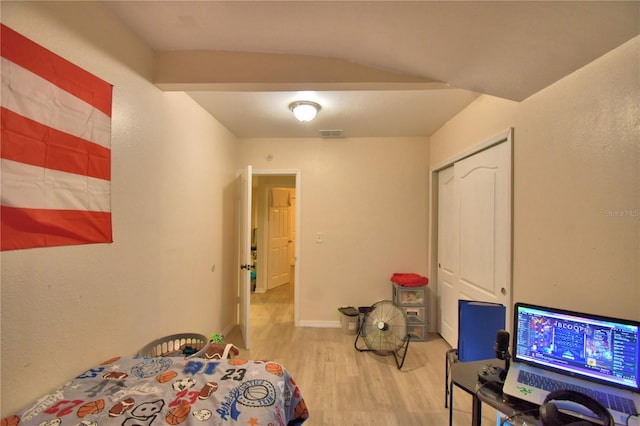 bedroom featuring a closet and light hardwood / wood-style flooring