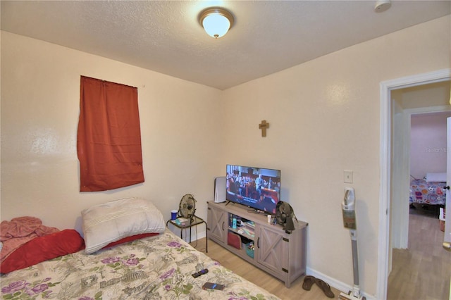 bedroom with light hardwood / wood-style flooring