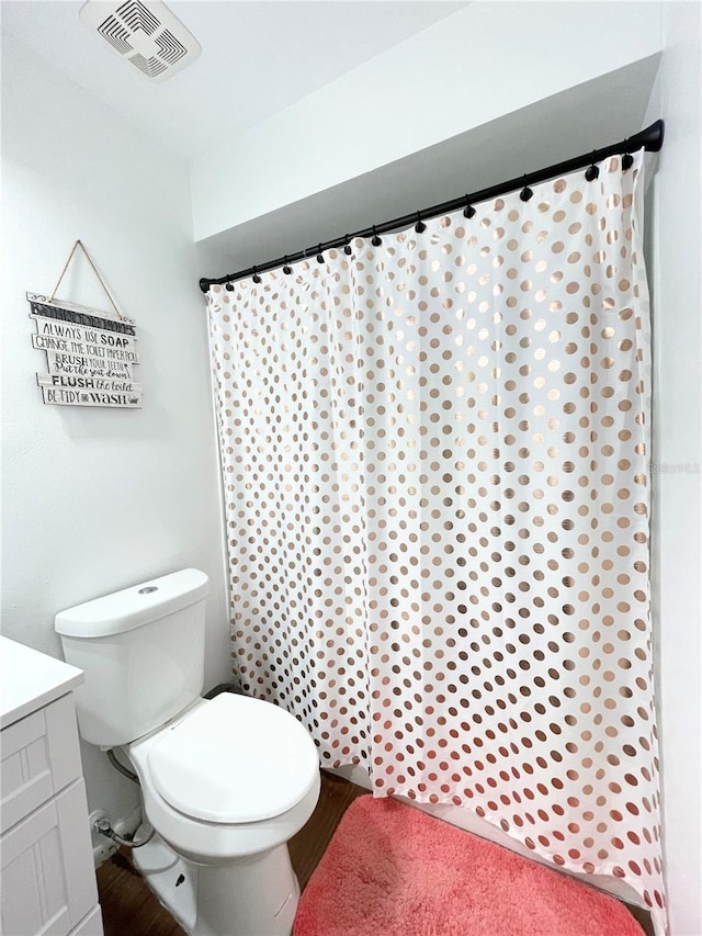 bathroom with vanity and toilet