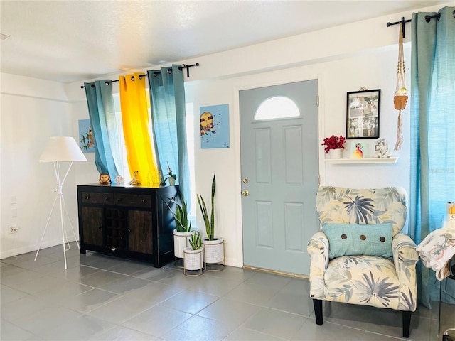 tiled entrance foyer featuring a wealth of natural light