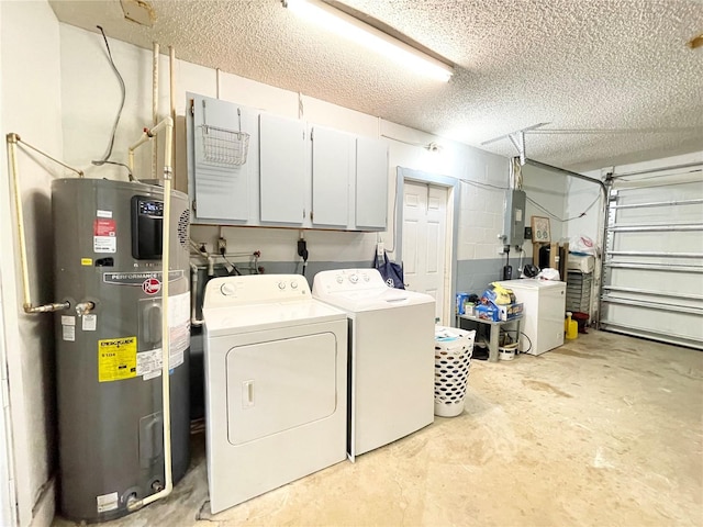 washroom featuring cabinets, electric panel, a textured ceiling, water heater, and washing machine and clothes dryer