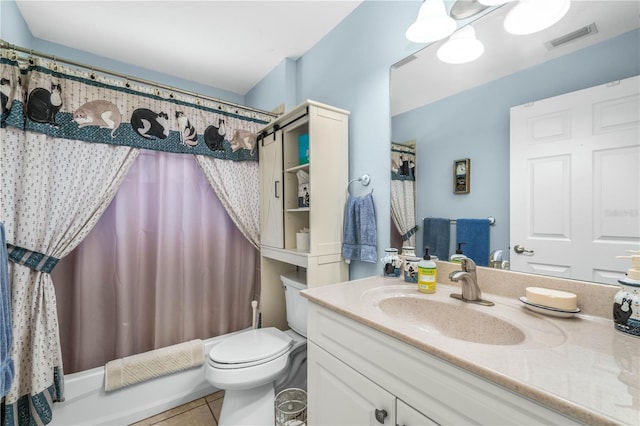 full bathroom featuring tile patterned flooring, vanity, toilet, and shower / bath combo