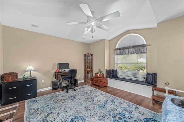 home office featuring ceiling fan, dark hardwood / wood-style flooring, and lofted ceiling