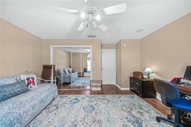 office area featuring ceiling fan and dark wood-type flooring