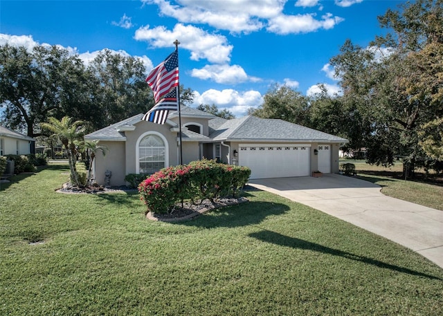 single story home with a front yard and a garage