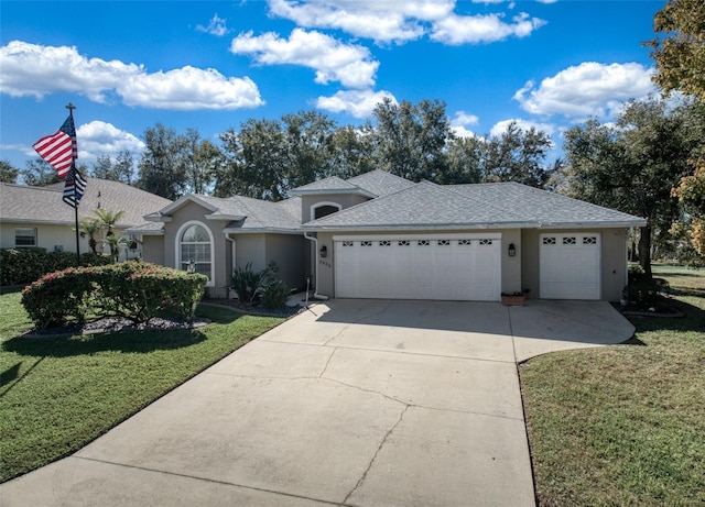 single story home with a front yard and a garage