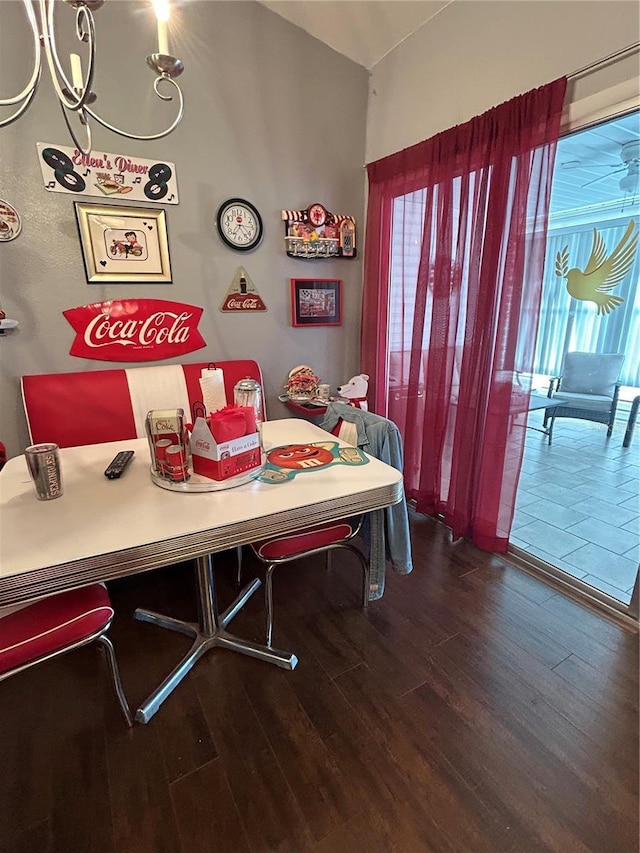 dining area featuring dark wood-type flooring