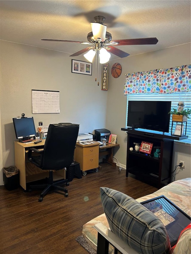 home office with a textured ceiling, ceiling fan, and dark hardwood / wood-style floors