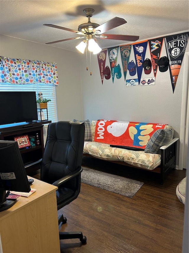 office with a textured ceiling, dark hardwood / wood-style floors, and ceiling fan