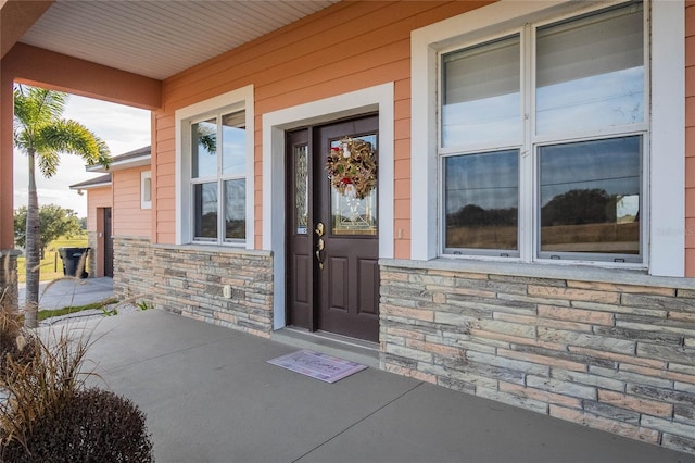 property entrance featuring covered porch