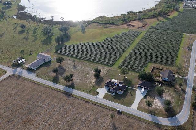 birds eye view of property with a rural view