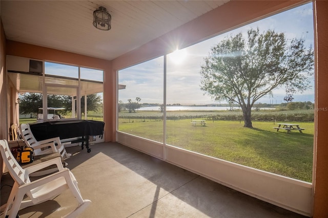 sunroom featuring a rural view