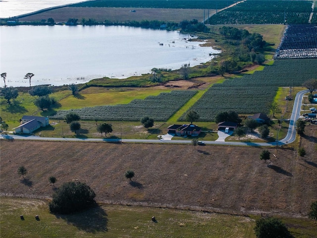 bird's eye view with a rural view and a water view