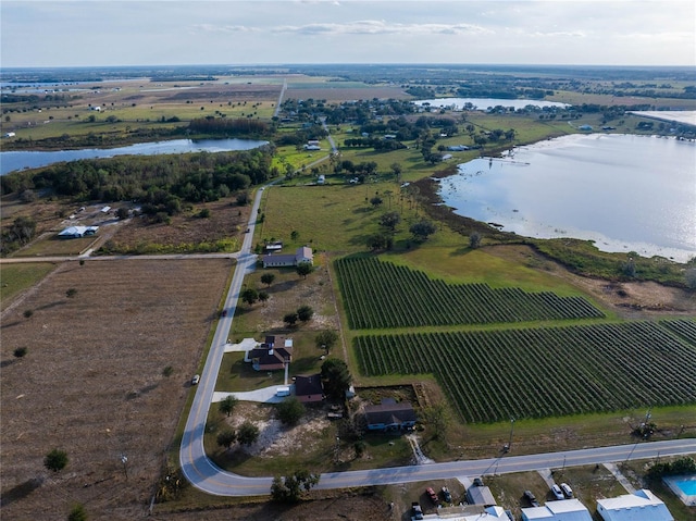 drone / aerial view featuring a rural view and a water view