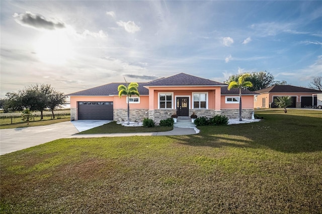 view of front of property with a garage and a front yard