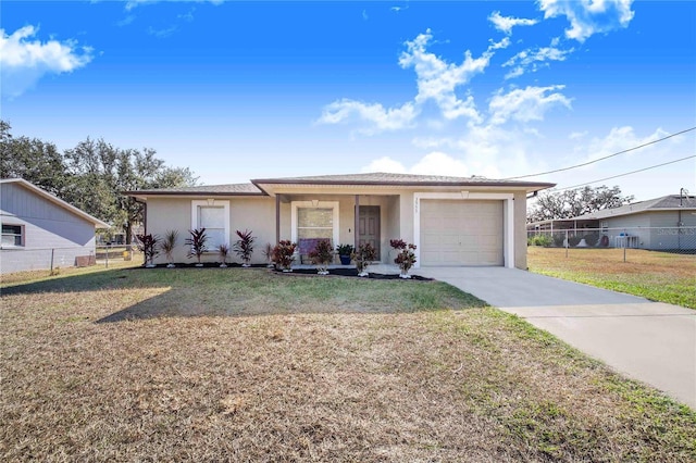 ranch-style house featuring a front yard, a garage, and covered porch