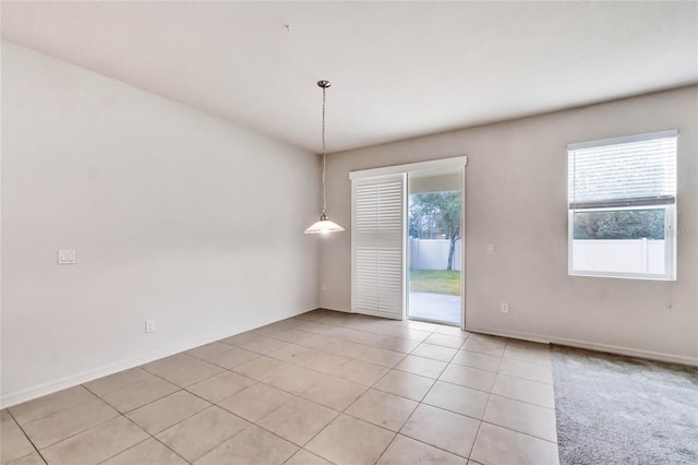 unfurnished room featuring light tile patterned flooring