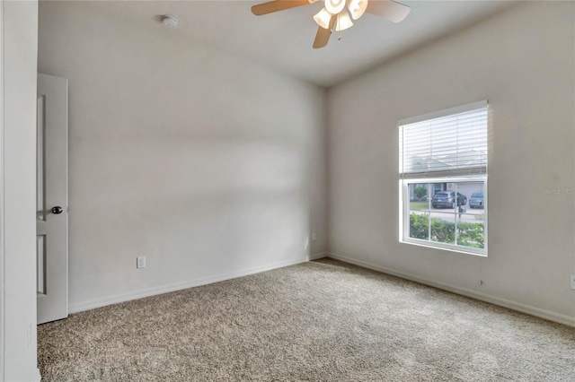 carpeted empty room with ceiling fan