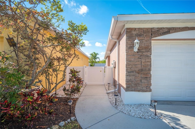 view of side of home featuring a garage