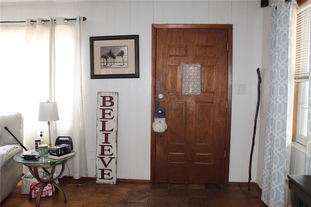 entryway featuring dark parquet floors