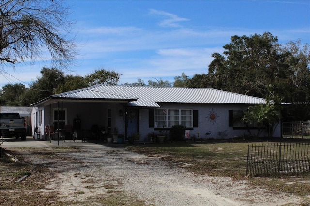 single story home with a carport