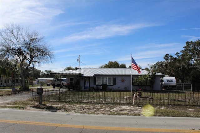 single story home featuring a carport